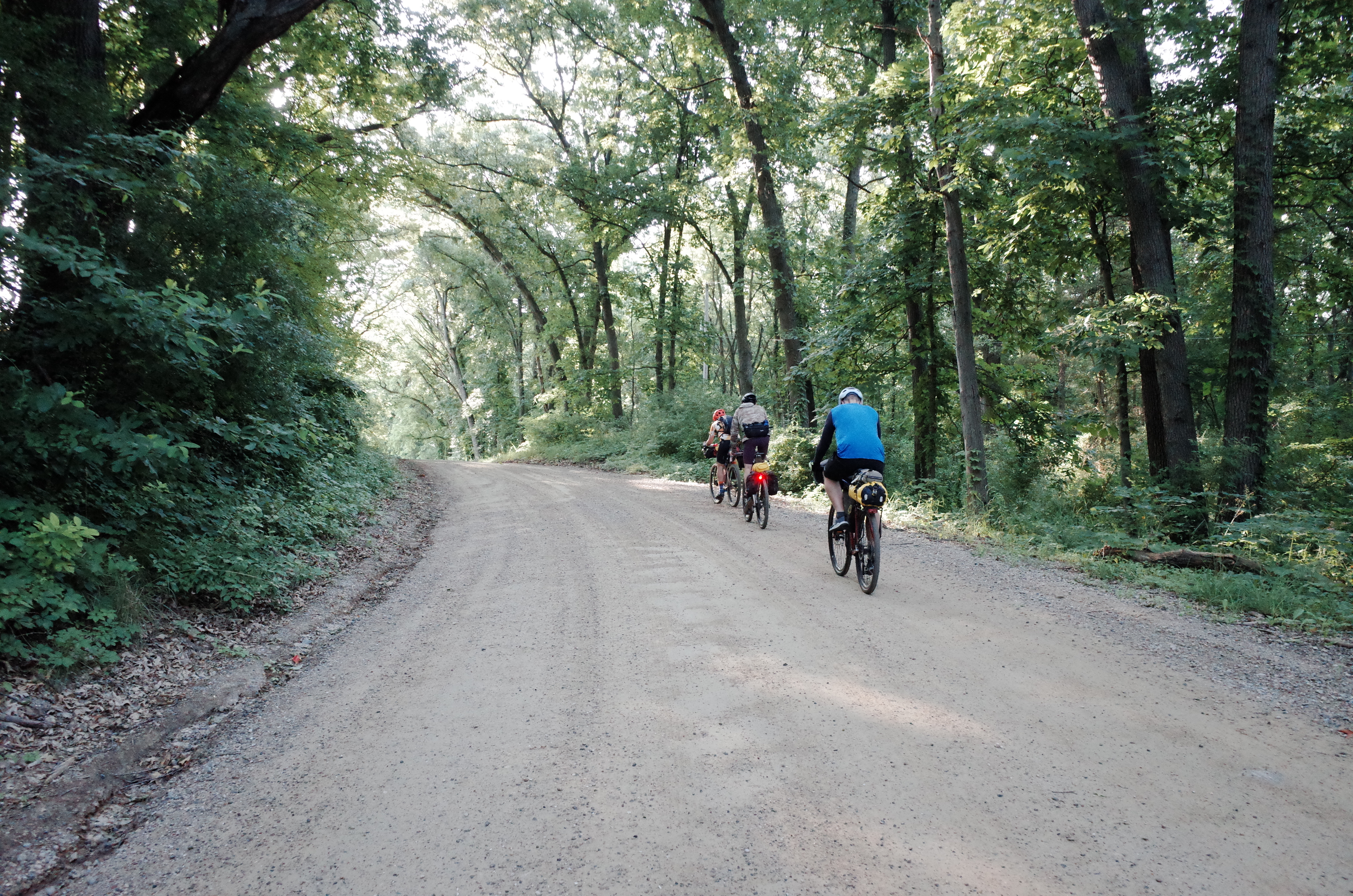Gravel cyclist climbing on a scenic route